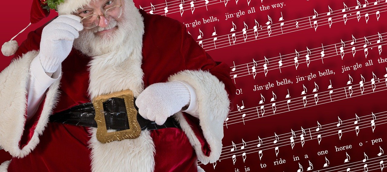 Święty Mikołaj, w tle zapis nutowy pisoenki „Jingle bells”